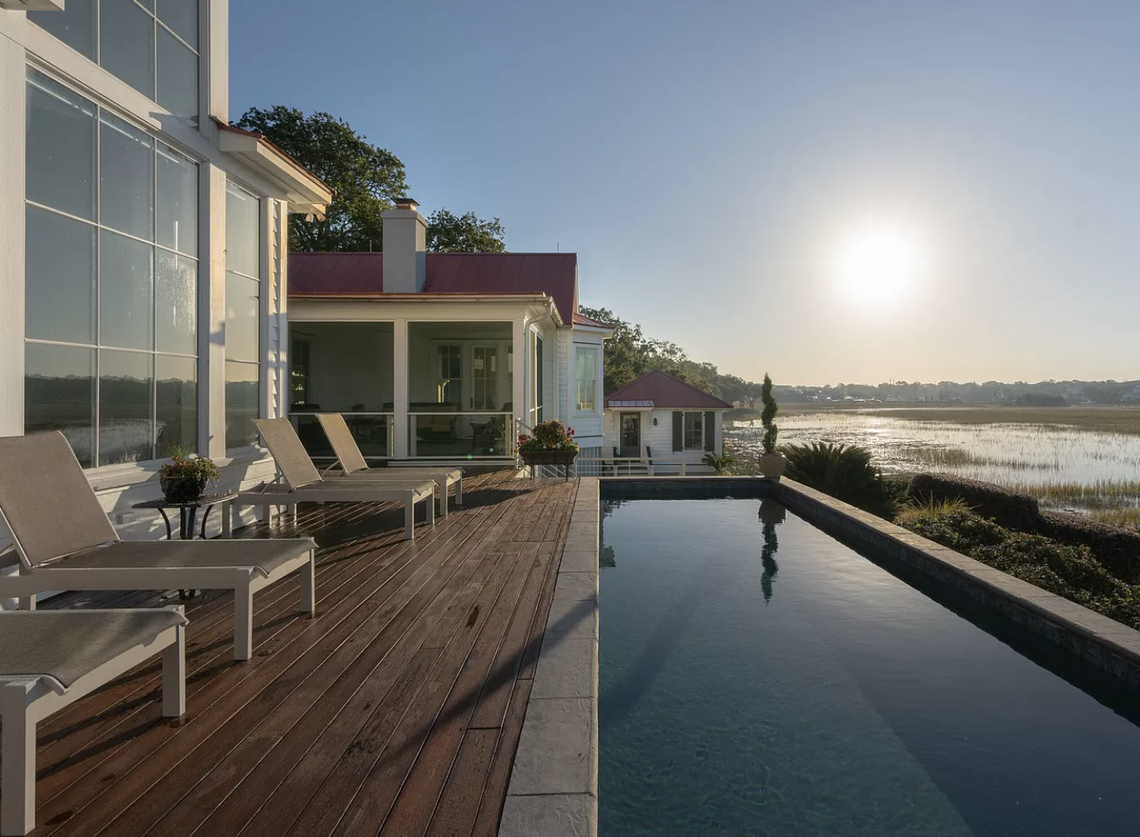 The pool overlooks the water.