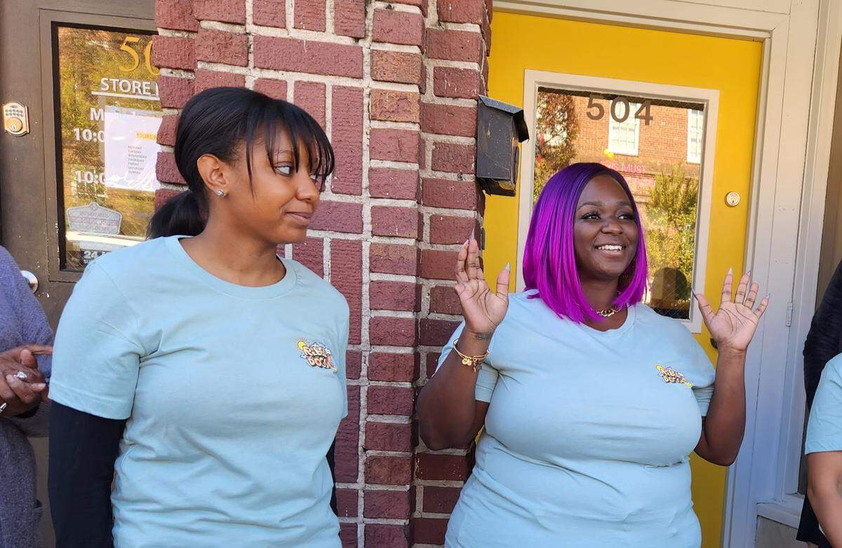 Rebel Dogs owner-operator Shelli Pue, right, welcomes customers to the restaurant’s first day on Nov. 13, 2023.