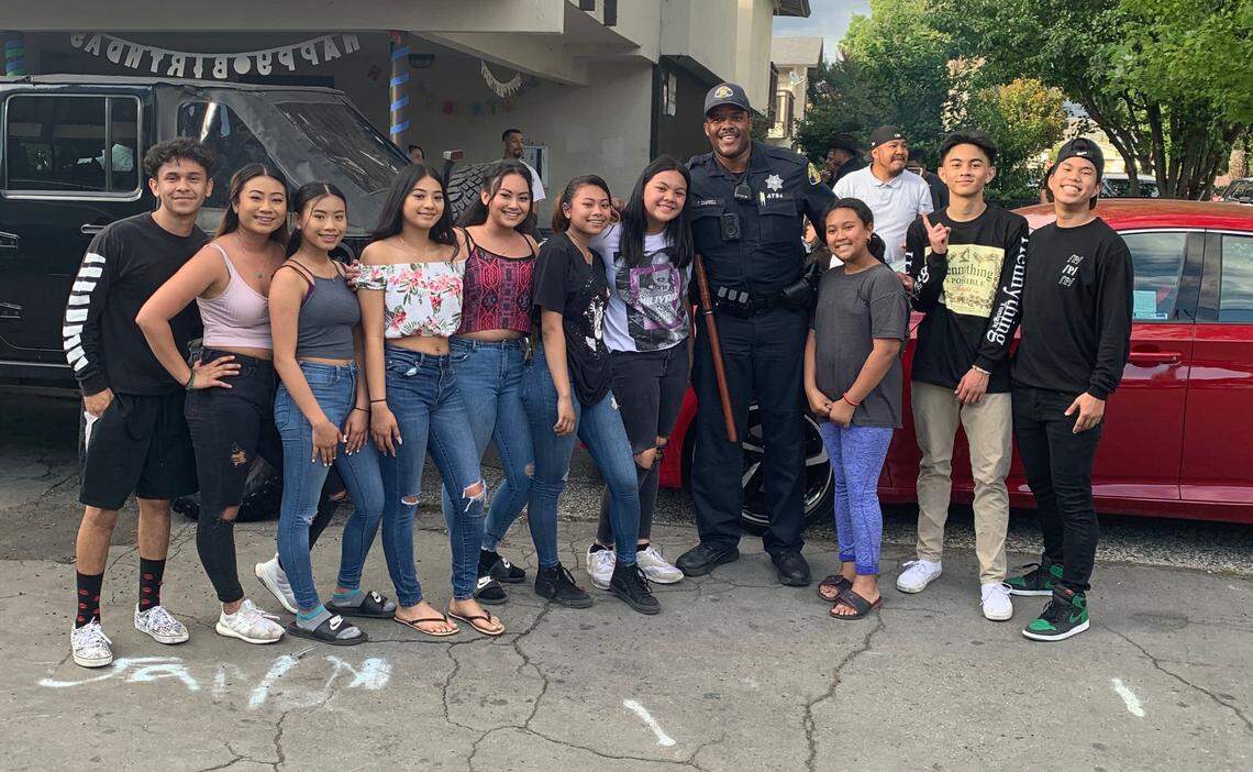 Terrence Campbell, now a police officer in San Jose, played a game of basketball with these local children May 30.