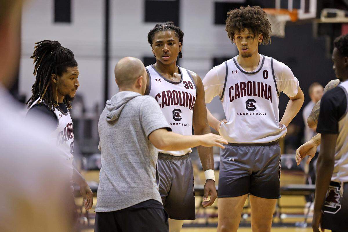 South Carolina’s Jordan Butler, right, listens along with Jamarii Thomas, left, and Collin-Murray Boyles during a summer men’s basketball practice on Tuesday, July 30, 2024 inside Carolina Coliseum.