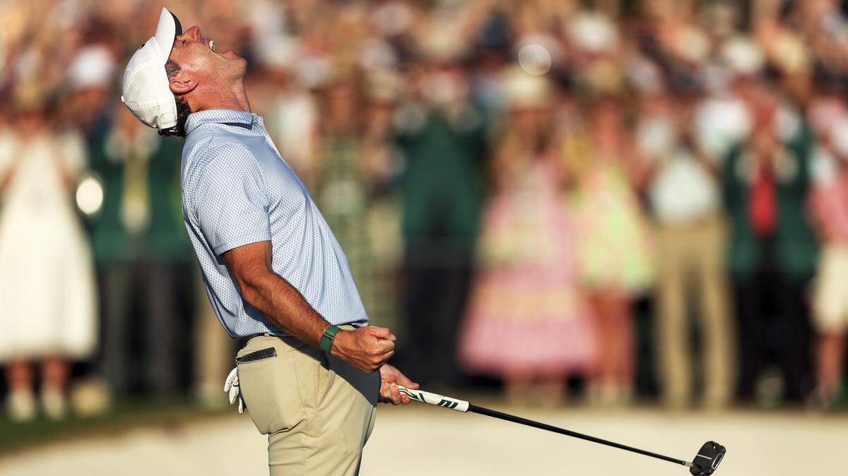 Rory McIlroy of Northern Ireland celebrates winning the 2026 Masters Tournament on the 18th green at Augusta National Golf Club on Sunday.