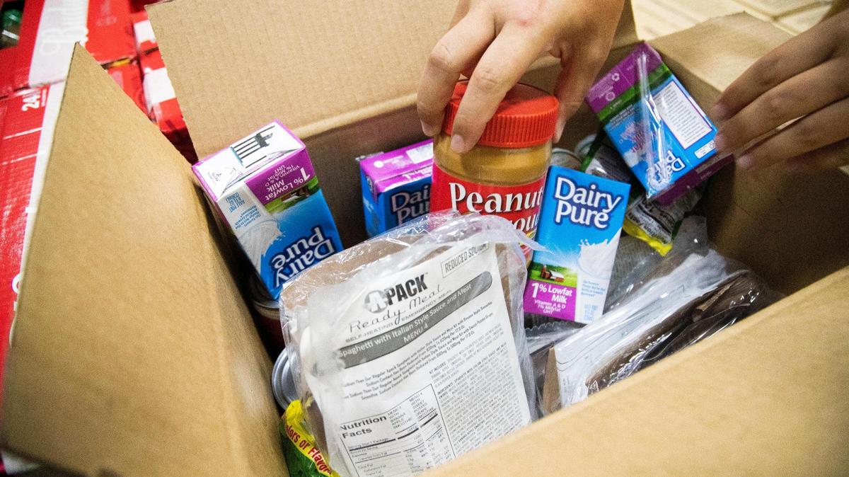 A box of food ready to be picked up by families in need at Harvest Hope food bank in Columbia, South Carolina on Wednesday, July 15, 2020. To help stop the spread of the coronavirus, the food bank did not let volunteers inside the warehouse to help pack the carryout boxes, adding to the strain on staff resources.