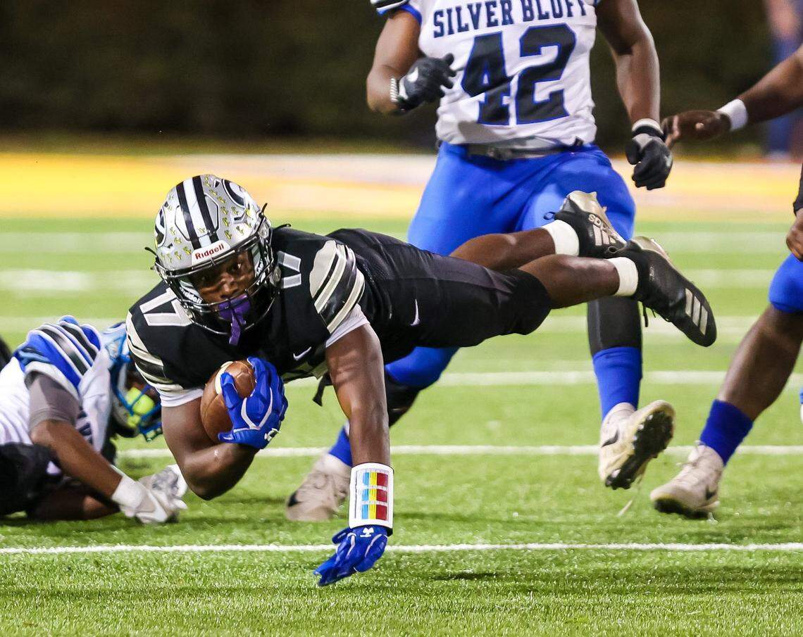 Gray Collegiate War Eagles KZ Adams (17) dives for yardage against the Silver Bluff Bulldogs in the Class 2A SC State Championship Game at Benedict College in Columbia, SC, Friday night, December 3, 2021.