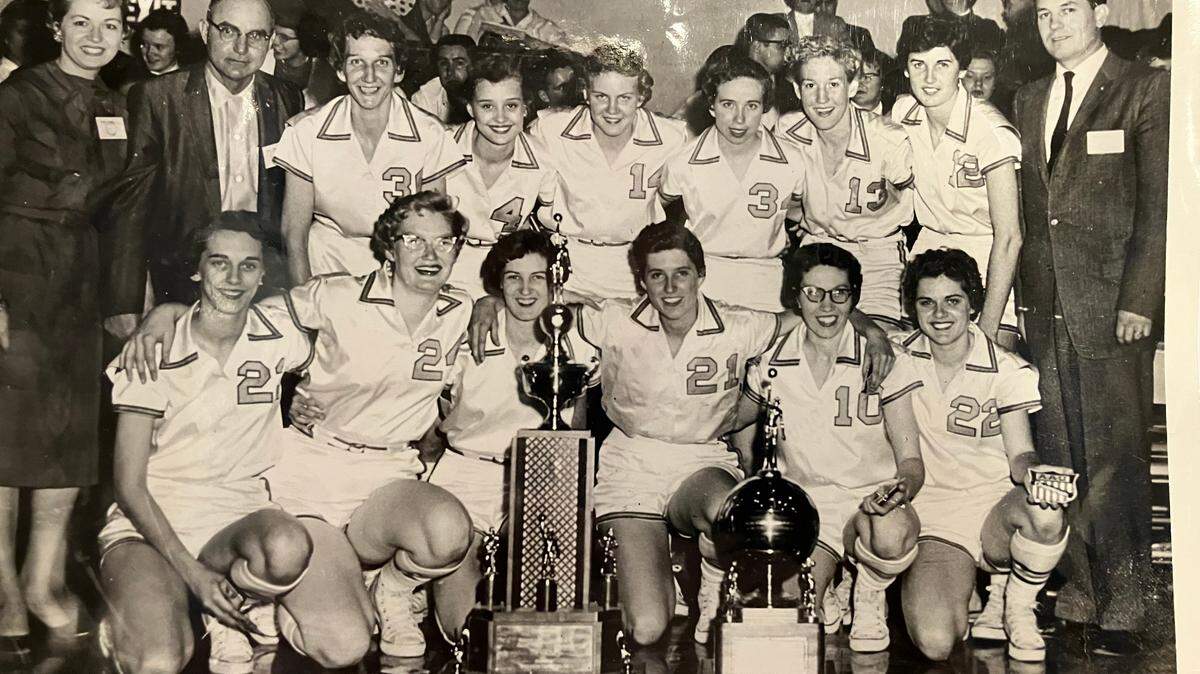 The Wayland College Hutcherson Flying Queens pose for a team photo after winning the 1959 AAU championship. The author is wearing No. 21 in the front row.