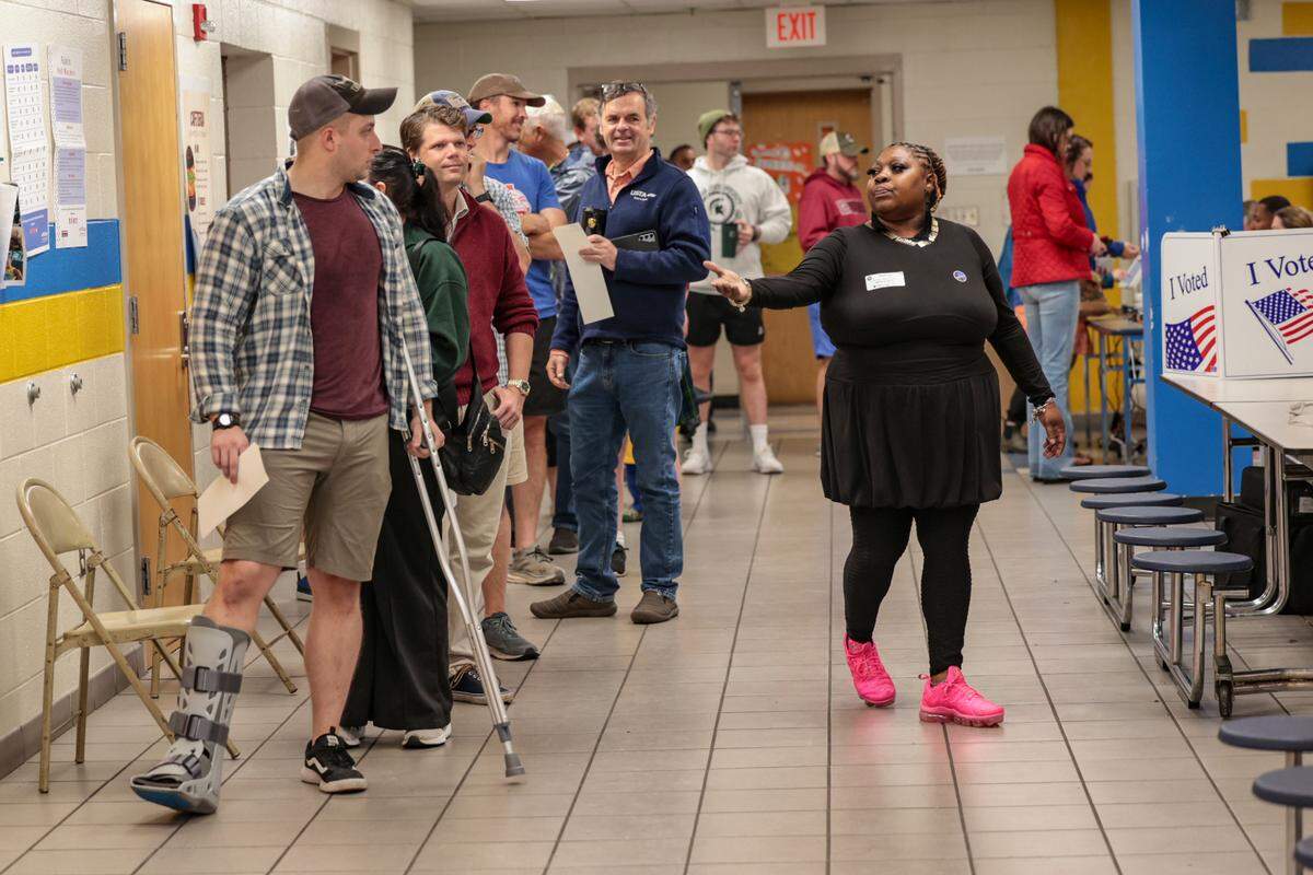 People wait in line to vote at Hand Middle School on Tuesday, Nov. 5, 2024.