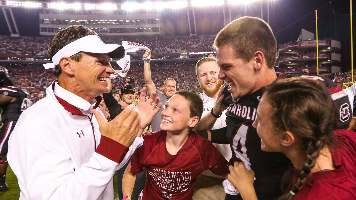 From 2016: Then-USC running backs coach Bobby Bentley celebrates the 24-21 win over Tennessee with son South Carolina quarterback Jake Bentley (4) at Williams-Brice Stadium in Columbia, SC, Saturday, October 29, 2016.