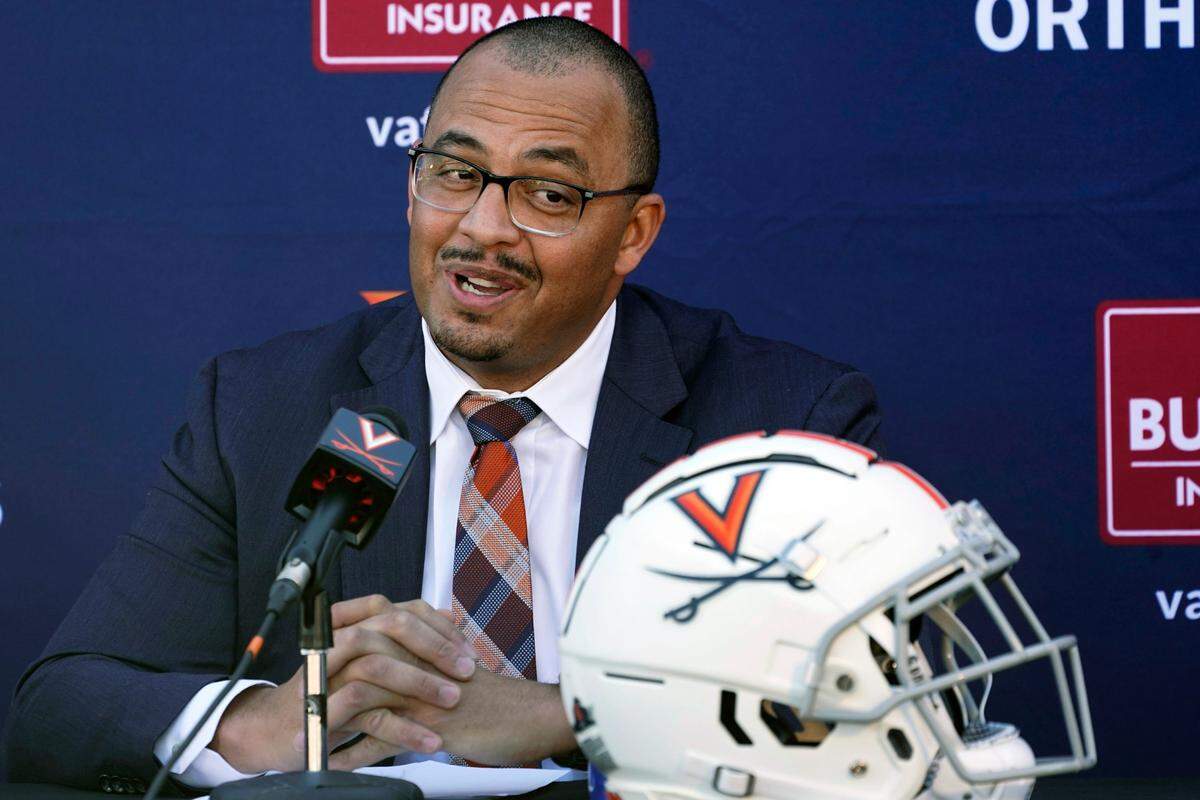 New Virginia head football coach and longtime Clemson assistant coach Tony Elliott speaks during an introductory NCAA college football news conference at the school, Monday, Dec. 13, 2021, in Charlottesville, Va. Elliott will take over the program after the upcoming bowl game. (AP Photo/Steve Helber)