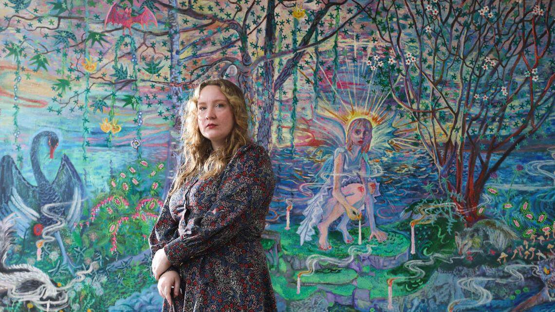 Lauren Chapman with her painting, Fairy Fire.