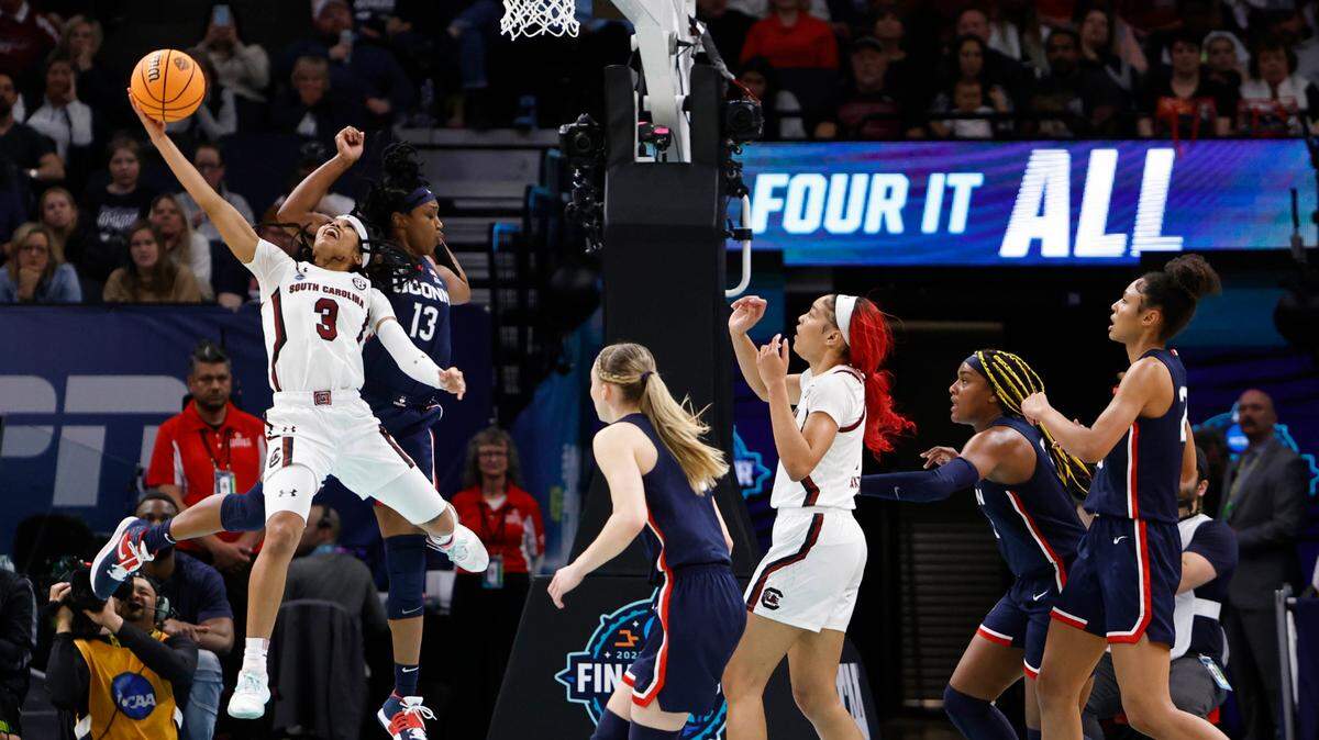 South Carolina’s Destanni Henderson (3) shoots over UConn’s Christyn Williams (13) during the second half of the national championship game against UConn at the Target Center in Minneapolis, Minn. on Sunday April 3, 2022.