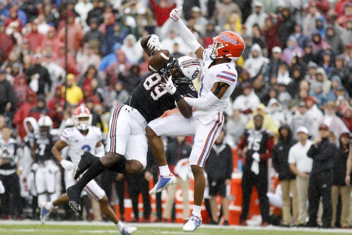 South Carolina’s Bryan Edwards (89) catches a pass as Florida’s CJ Henderson (1) defends in the first half of an NCAA college football game Saturday, Oct. 19, 2019, in Columbia, SC.