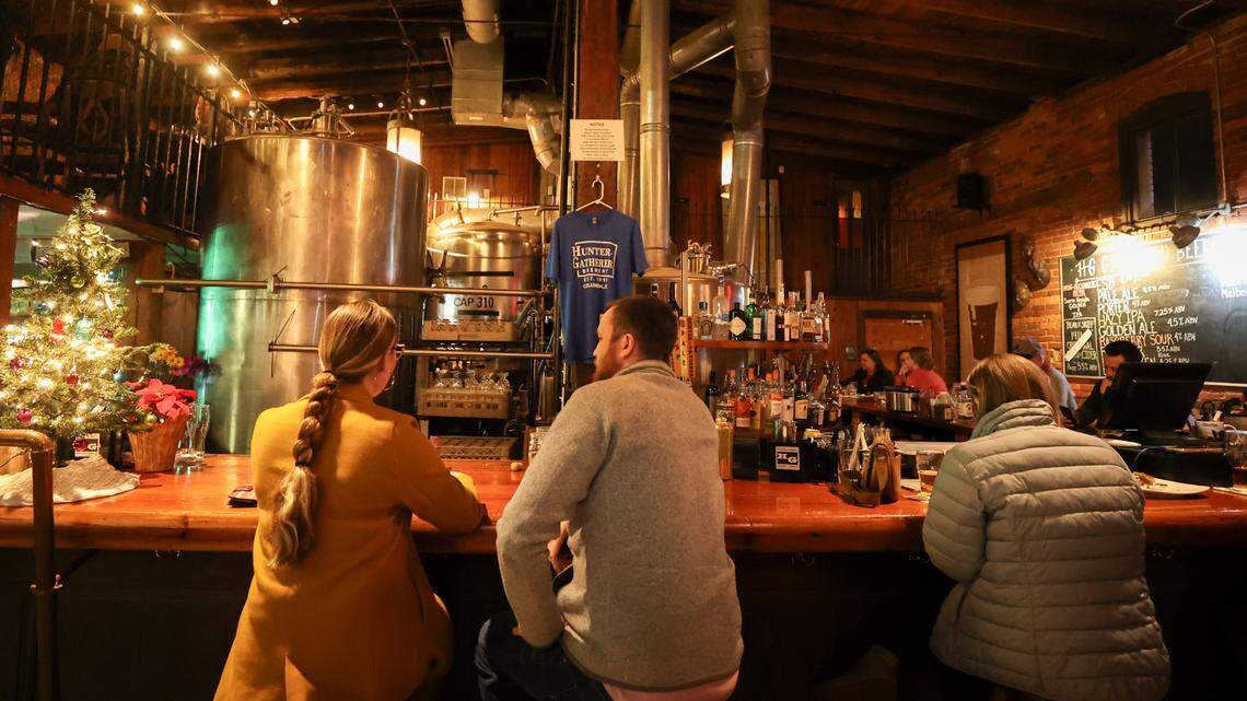 Patrons enjoy dinner and drinks at Hunter Gatherer in Columbia on Thursday Dec. 12, 2024. Hunter Gatherer opened in 1995 as Columbia’s first microbrewery.
