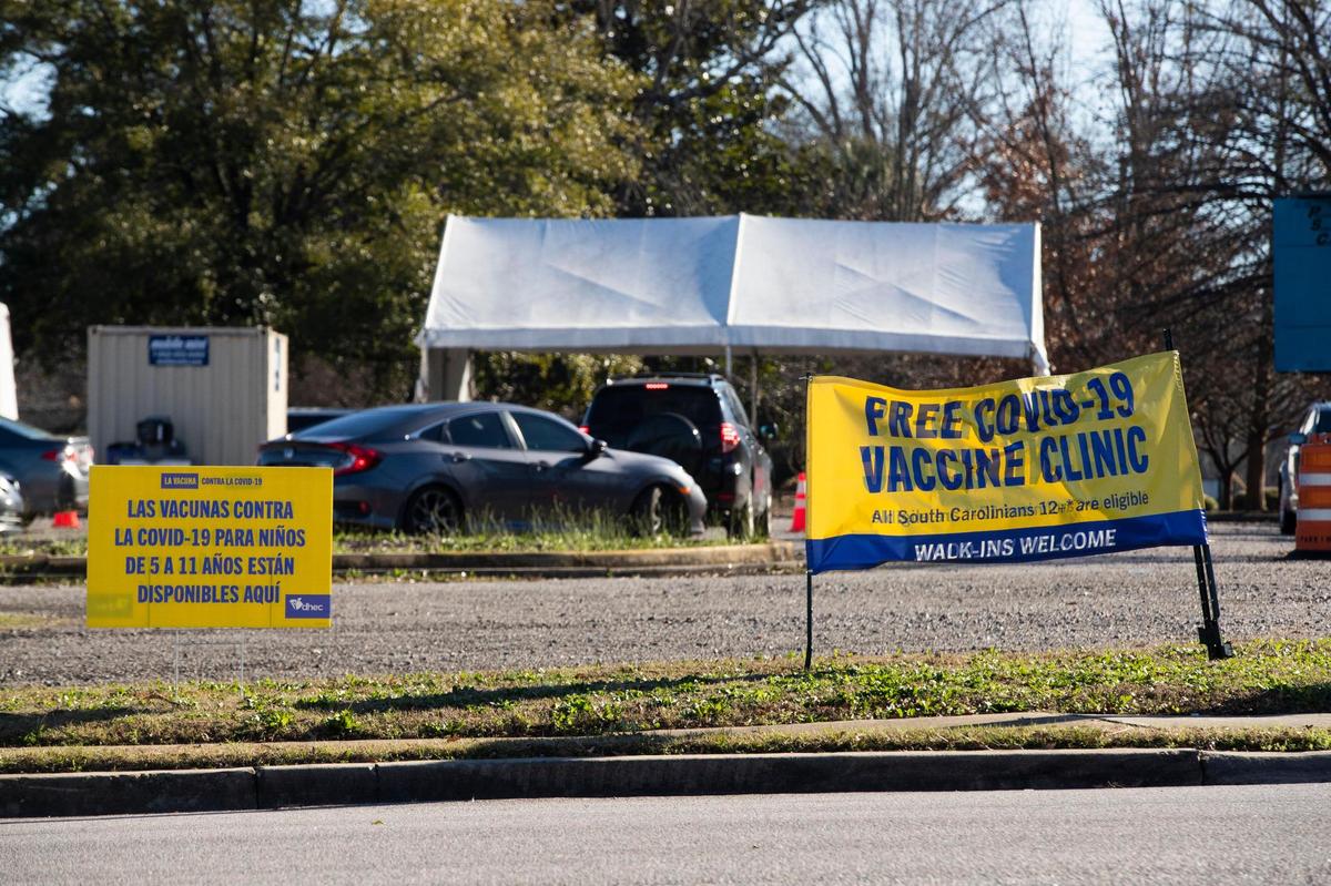 Dozens of people wait in their cars for coronavirus tests and vaccines at the Department of Health and Environmental Control on Tuesday, Jan. 4, 2022.