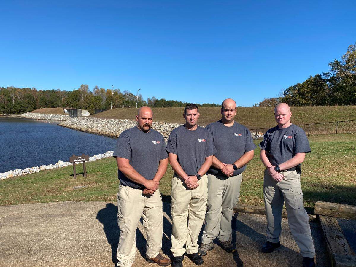 From left, Robert Trusty, Josh Yale, Russ Beam and Justin Church rescued a man on the precipice of going over a dam.