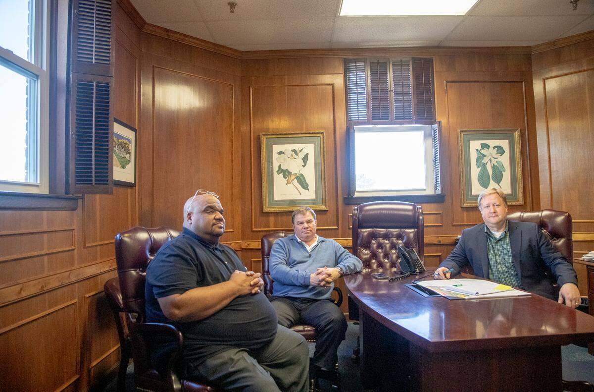 Davis Anderson, deputy county administrator, left, Ty Davenport, director of economic development and county administrator Jason Taylor sit inside the Fairfield County government building Tuesday Dec. 18, 2018, in Winnsboro, SC.