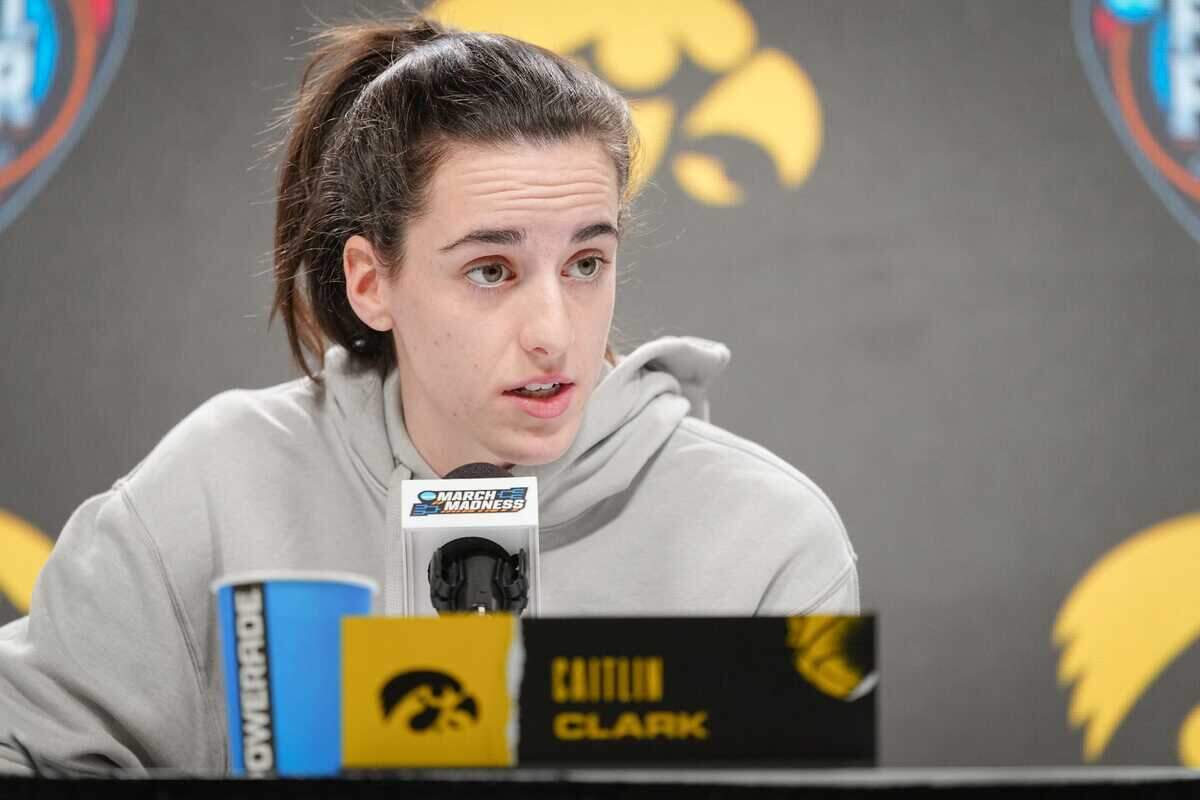 Iowa Hawkeyes guard Caitlin Clark (22) takes questions before practice for the NCAA Women’s Final Four championship basketball game at Rocket Mortgage Fieldhouse, Saturday, April 6, 2024 in Cleveland.
