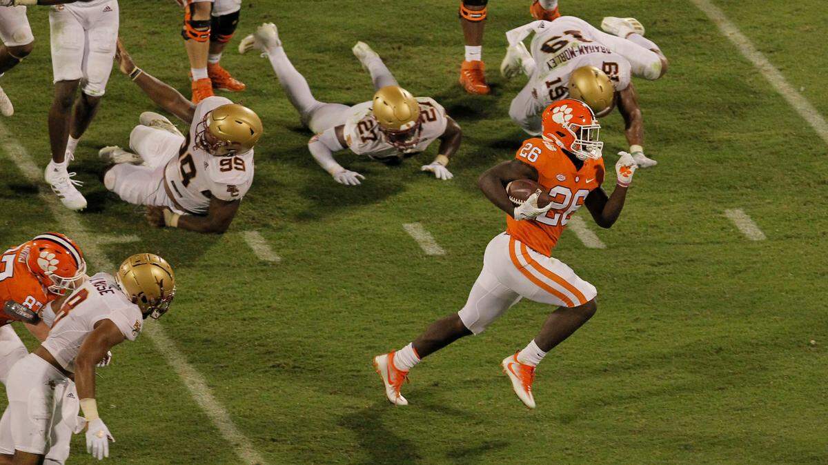 Boston College’s defense falls down as Clemson running back Phil Mafah (26) breaks away for a big run during second-quarter action in Clemson, S.C. on Saturday, Oct. 2, 2021. (Travis Bell/SIDELINE CAROLINA)