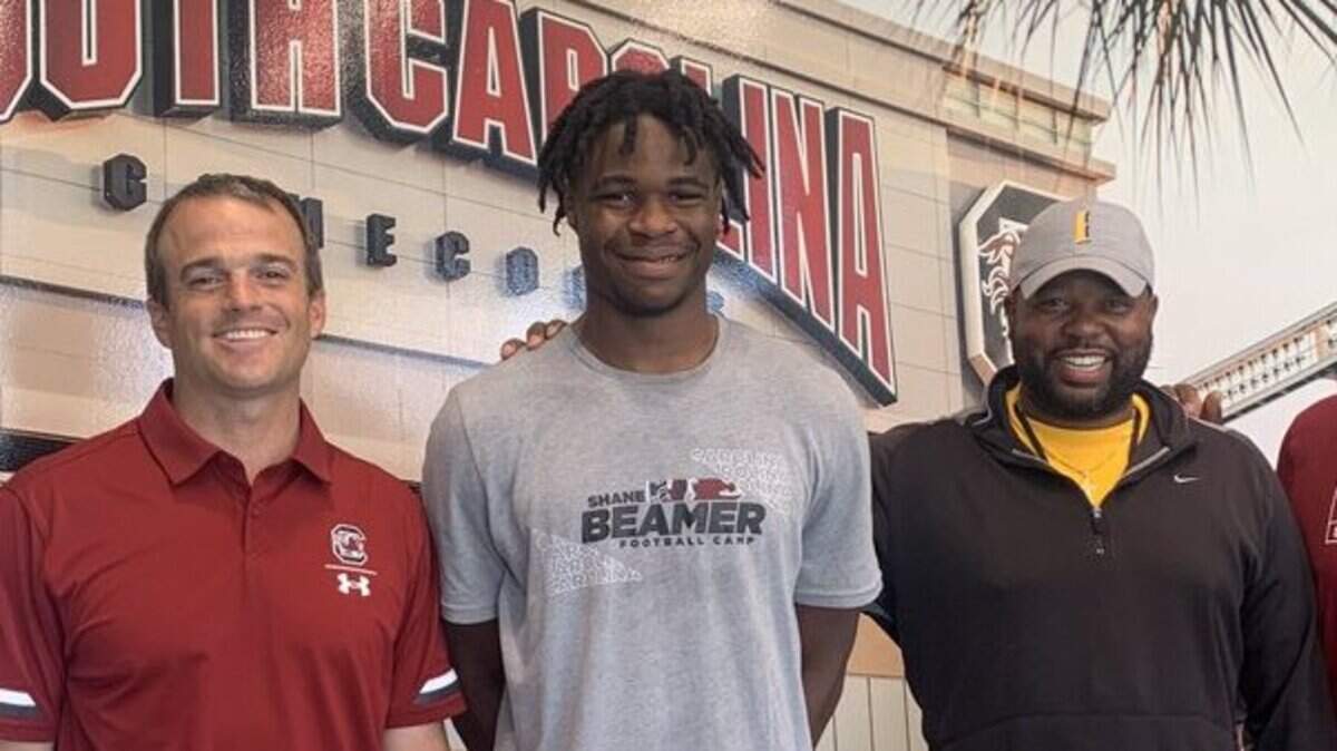 Nick Emmanwori of Irmo High School, middle, picked up an offer from South Carolina on Friday.