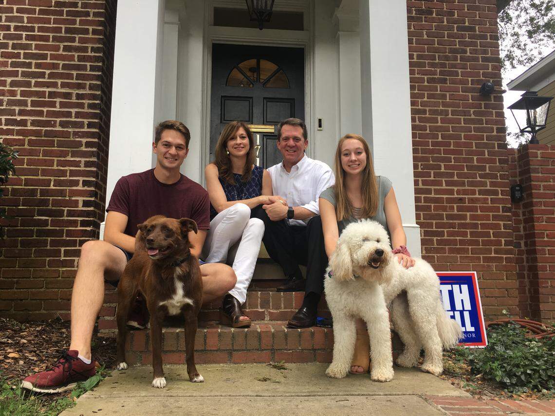 Dogs are just part of the family in the Smith household. Pictured is Democratic candidate for S.C. governor James Smith, back right; his wife, Kirkland; two of four children, Thomas and Shannon; and their dogs Laffey, left, and Cayman.