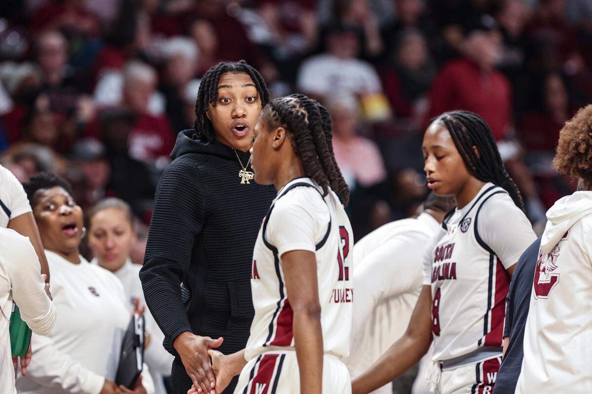 University of South Carolina’s Ashlyn Watkins (2) encourages University of South Carolina’s MiLaysia Fulwiley (12) during the second half of action in the Colonial Life Arena on Thursday, Jan. 9, 2025.