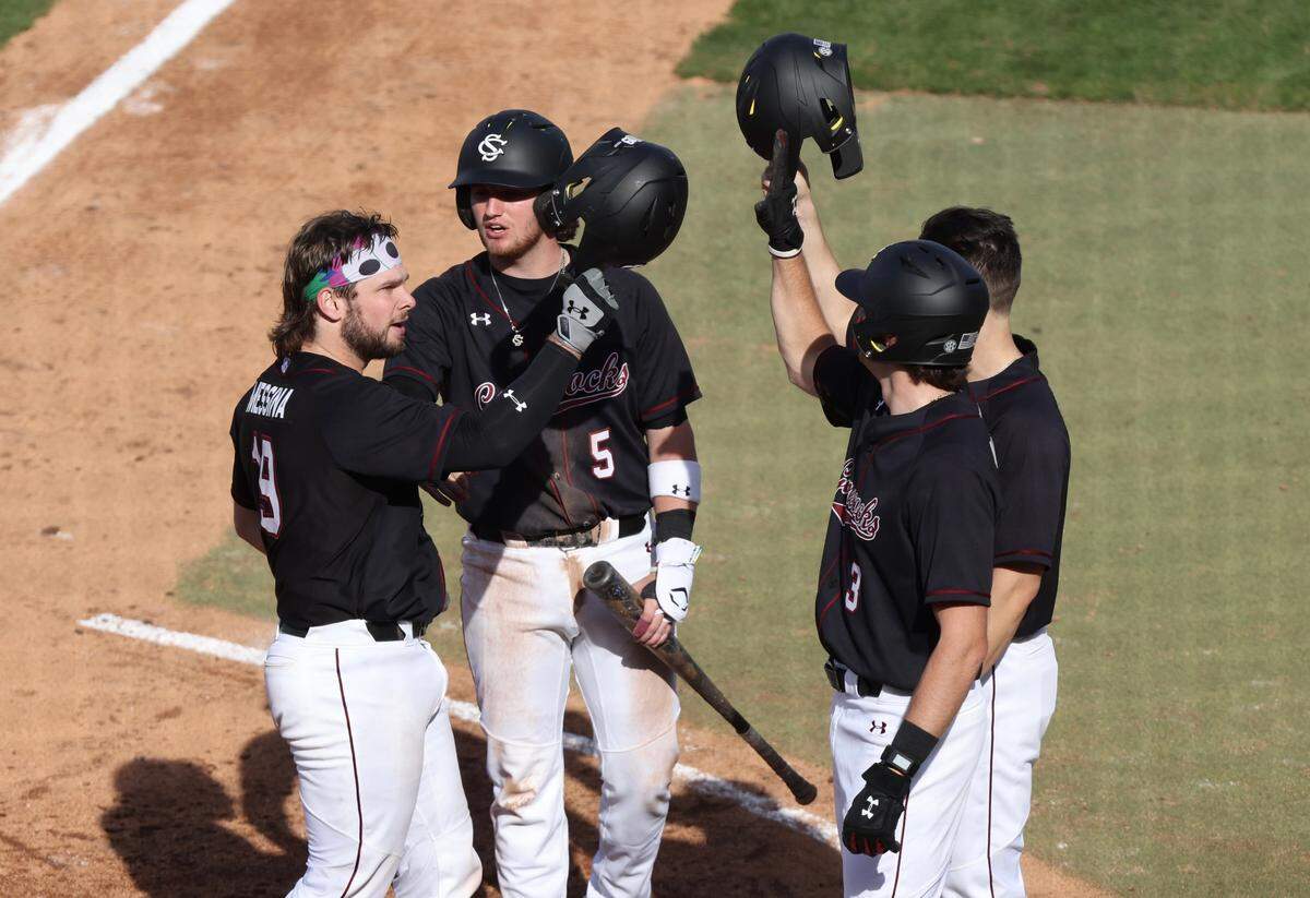 South Carolina’s Cole Messina celebrates a home run in the game against UMass Lowell in Columbia on Sunday, Feb. 19, 2023.