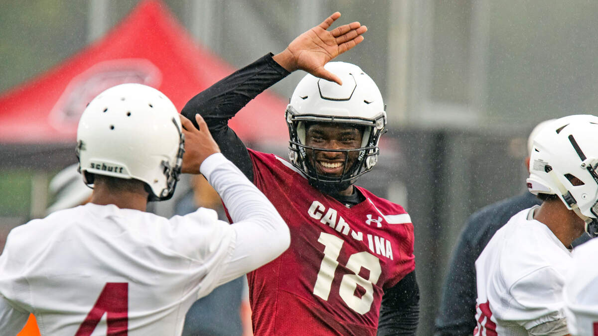 South Carolina’s OrTre Smith high-fives Jaylin Dickerson at the first preseason practice Friday, August 6, 2021.