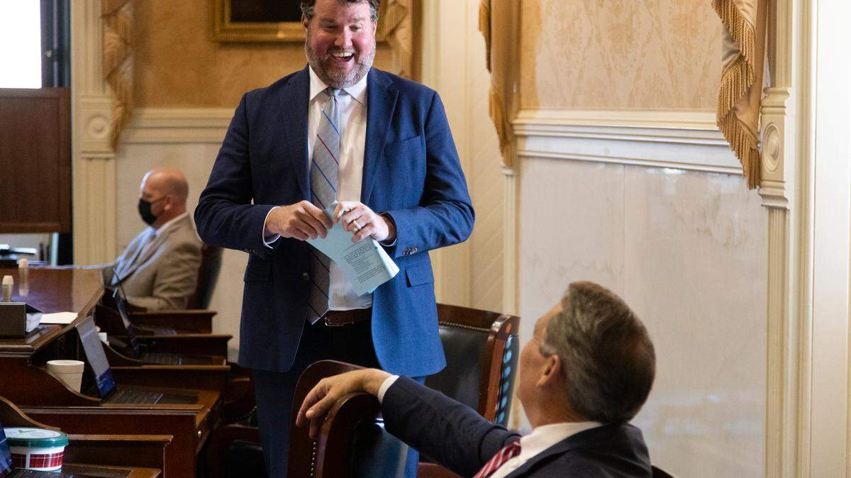 S.C. Sen. Scott Talley, R-Spartanburg, speaks with colleagues in the Senate chambers of the South Carolina State House on January 11, 2022.