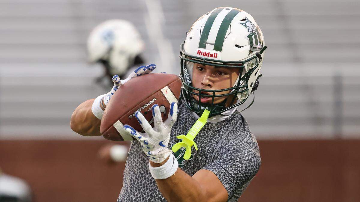 Stone Furrey (14) of Dutch Fork warms up before White Knoll’s game against visiting Dutch Fork in Lexington on Friday, October 10, 2025.