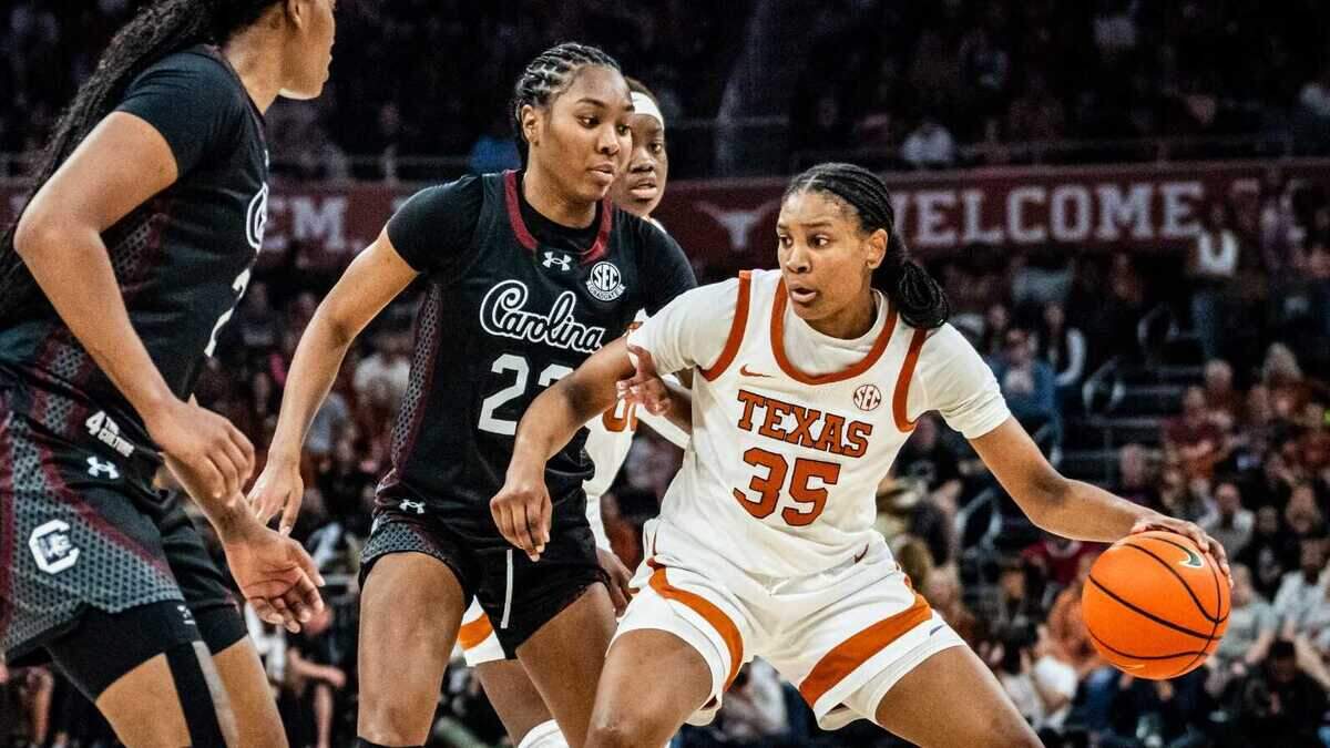Texas Longhorns forward Madison Booker (35) drives into the let around South Carolina Gamecocks defense in the second half as the Longhorns take on the Gamecocks at the Moody Center, Feb. 9, 2025. Texas won the game 66-62.