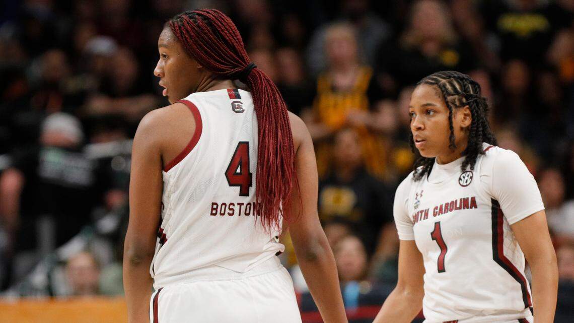South Carolina Gamecocks forward Aliyah Boston (4) and guard Zia Cooke (1) low-five one another during the game against Iowa in the NCAA Tournament Final Four game at the American Airlines Center on Friday.