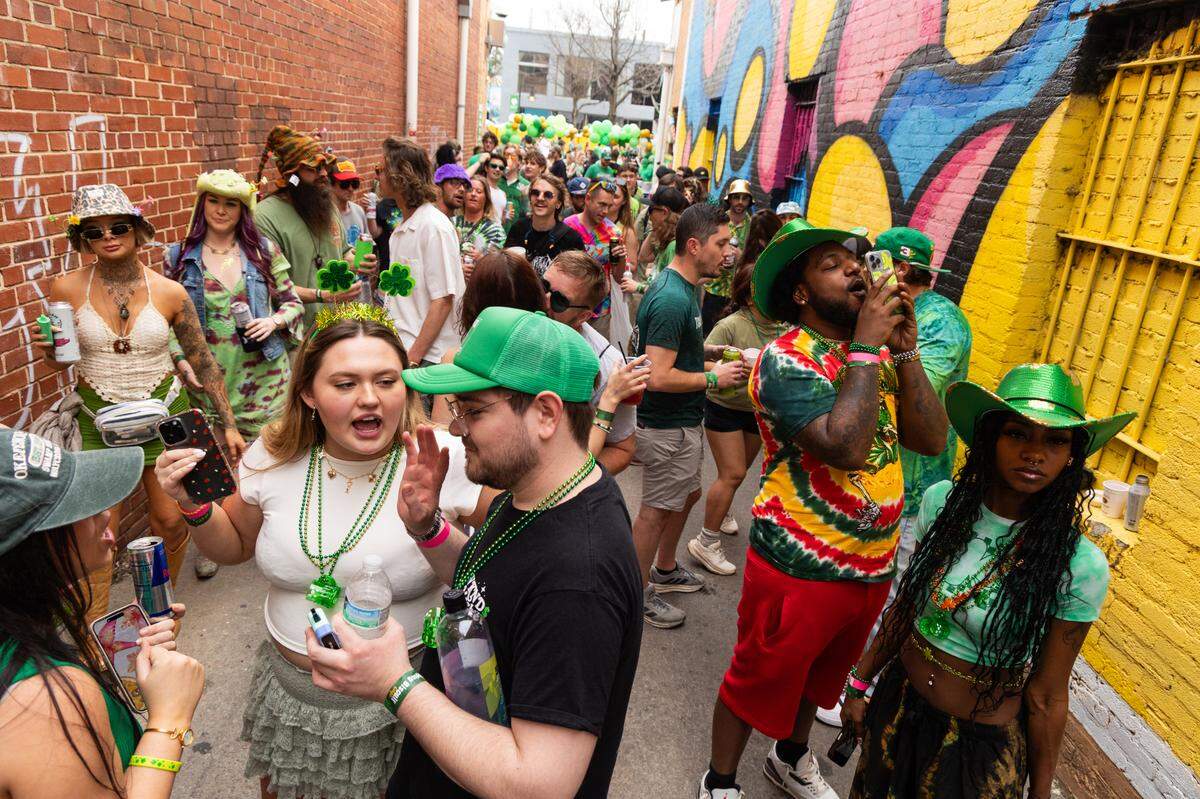 DJs spin tracks in the alley on Saluda Avenue during the St. Pat’s in Five Points festival in Columbia, South Carolina on Saturday, March 15, 2025.