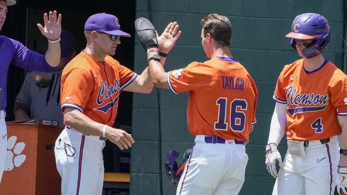Clemson head coach Erik Bakich high fives outfielder Will Taylor (16) after he scores during the NCAA Baseball Regional against the Lipscomb Bisons at Clemson University on Friday, June 2, 2023.