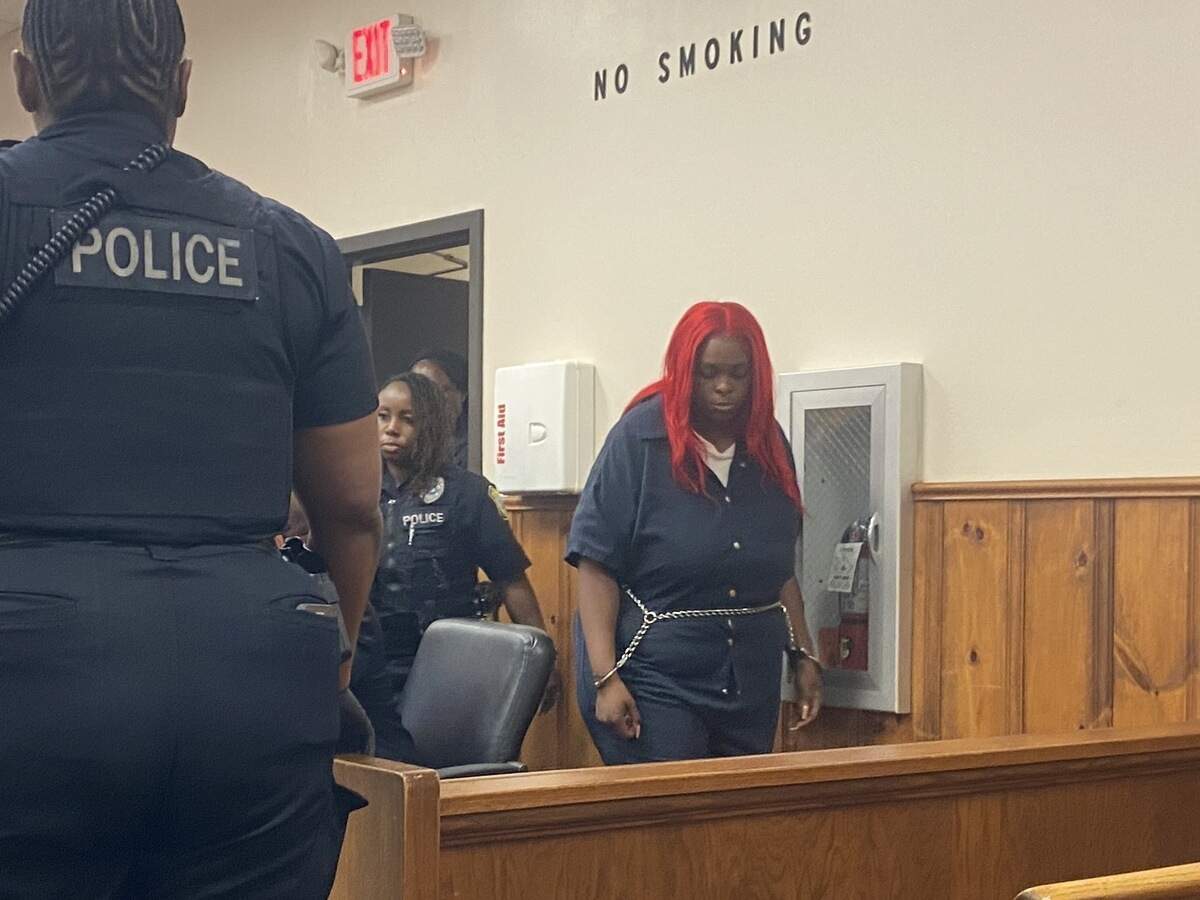 Zana Oden enters the courtroom for her bond hearing July 1. A mother of three children is accused of leaving them unattended for at least a week prior to a house fire that left them in critical condition.