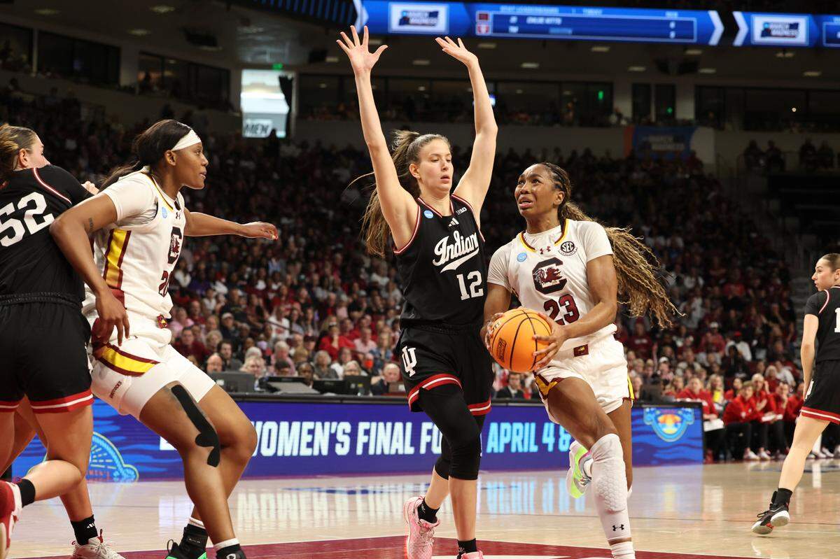 University of South Carolina’s Bree Hall (23) looks to shoot around Indiana University’s Yarden Garzon (12) during the second half of action in the Second Round game of the NCAA Tournament at the Colonial Life Arena on Sunday, March 23, 2025.
