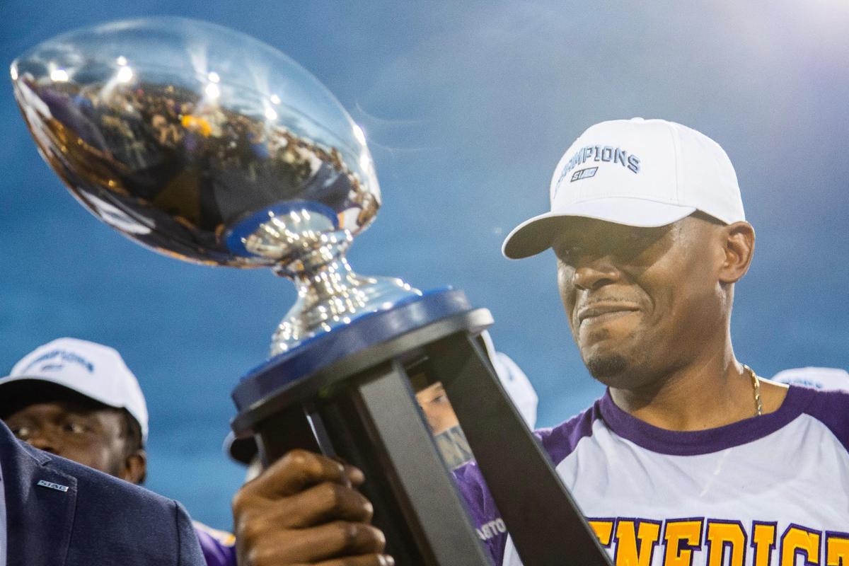 Benedict College head football coach Chennis Berry looks at the SIAC championship trophy after defeating Tuskegee on Saturday, November 12, 2022.