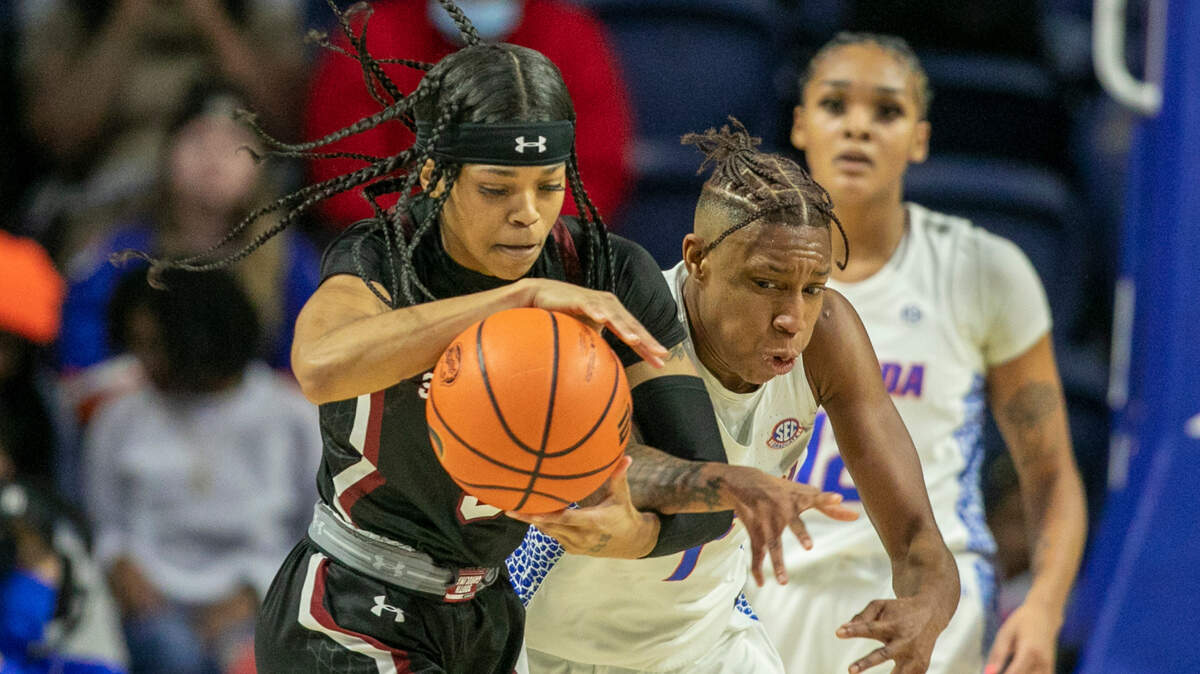 South Carolina guard Destanni Henderson, left, battles Florida guard Kiara Smith, right, during the first half of an NCAA college basketball game Sunday, Jan. 30, 2022, in Gainesville, Fla.