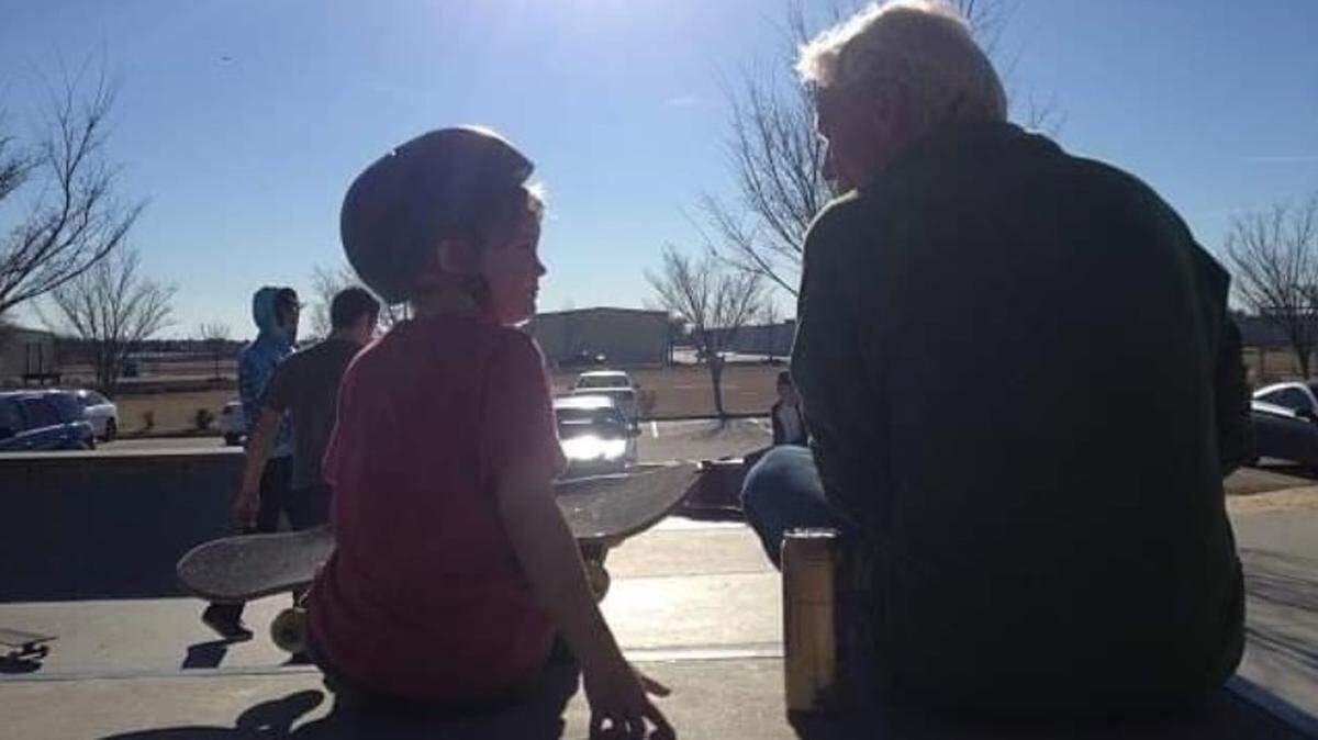 Michael Mayfield speaks with a young skateboarder at the Owens Field Skate Park