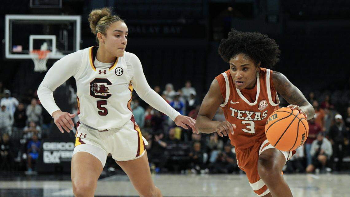 LAS VEGAS, NEVADA - NOVEMBER 27: Rori Harmon #3 of the Texas Longhorns drives past Tessa Johnson #5 of the South Carolina Gamecocks in the second half of the championship game of the 2025 Players Era Championship basketball tournament at Michelob ULTRA Arena on November 27, 2025 in Las Vegas, Nevada. The Longhorns defeated the Gamecocks 66-64. (Photo by Candice Ward/Getty Images)