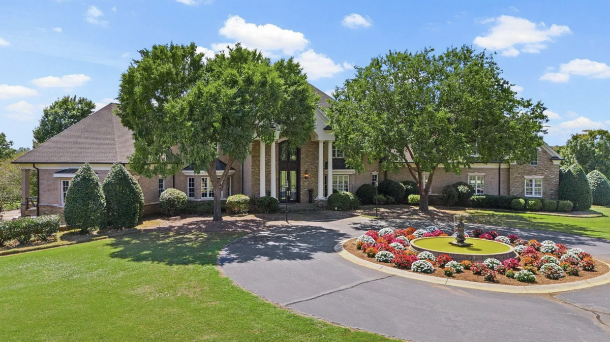 A long drive leads to the 16,000-square-foot house.