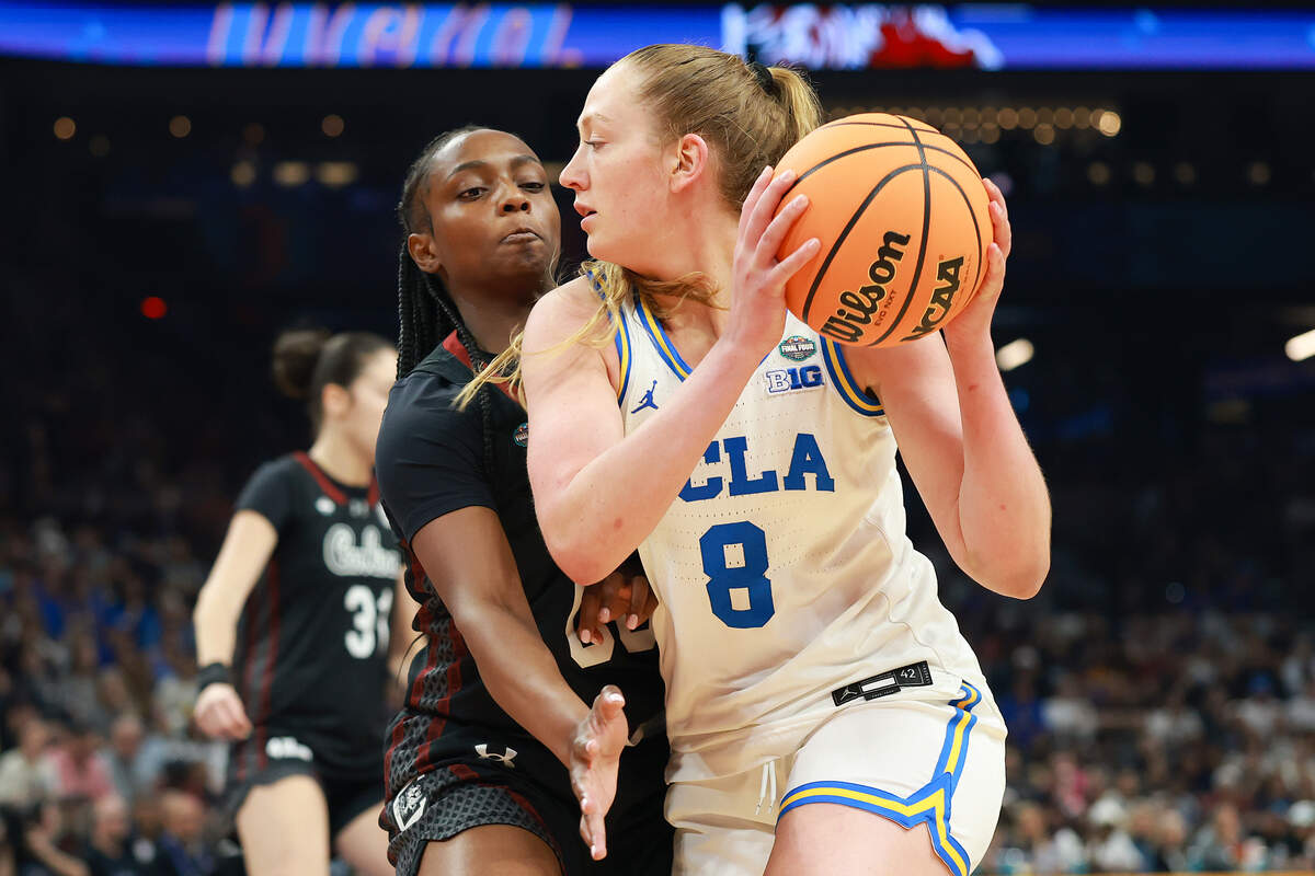 Gianna Kneepkens #8 of the UCLA Bruins looks to pass the ball against Ta'niya Latson #00 of the South Carolina Gamecocks during the first quarter in the National Championship of the NCAA Women's Basketball Tournament at Mortgage Matchup Center on April 05, 2026 in Phoenix, Arizona.