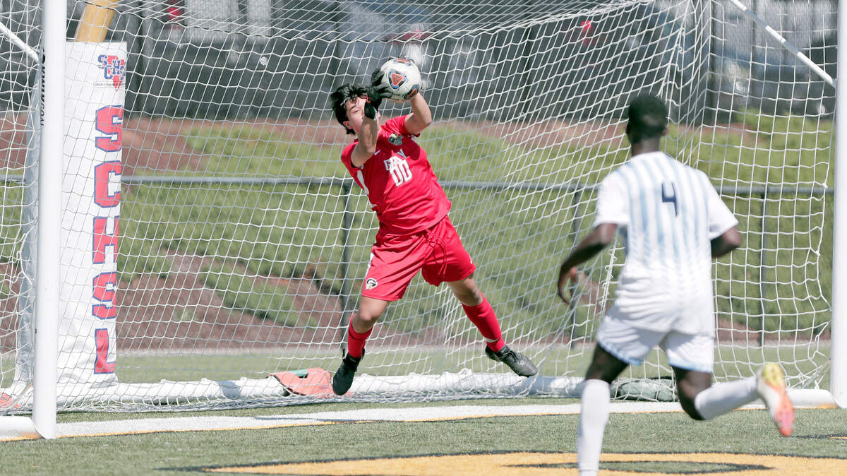 Gray Collegiate goalie Joey Sullivan records a save against Christ Church during the 2022 Class 2A boys soccer state championship match Saturday, held at Irmo High School.