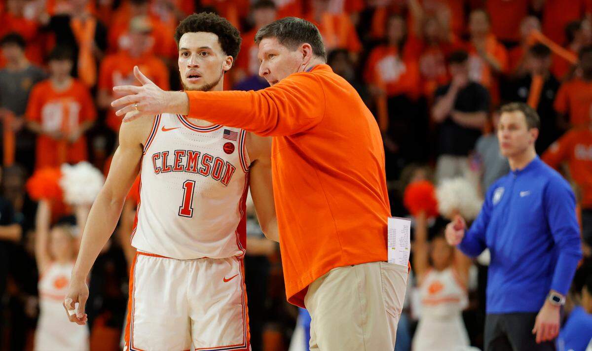 Clemson head coach Brad Brownell talks with Clemson guard Chase Hunter (1) against Duke during second-half action in Clemson, S.C. on Saturday, Feb. 8, 2025.
