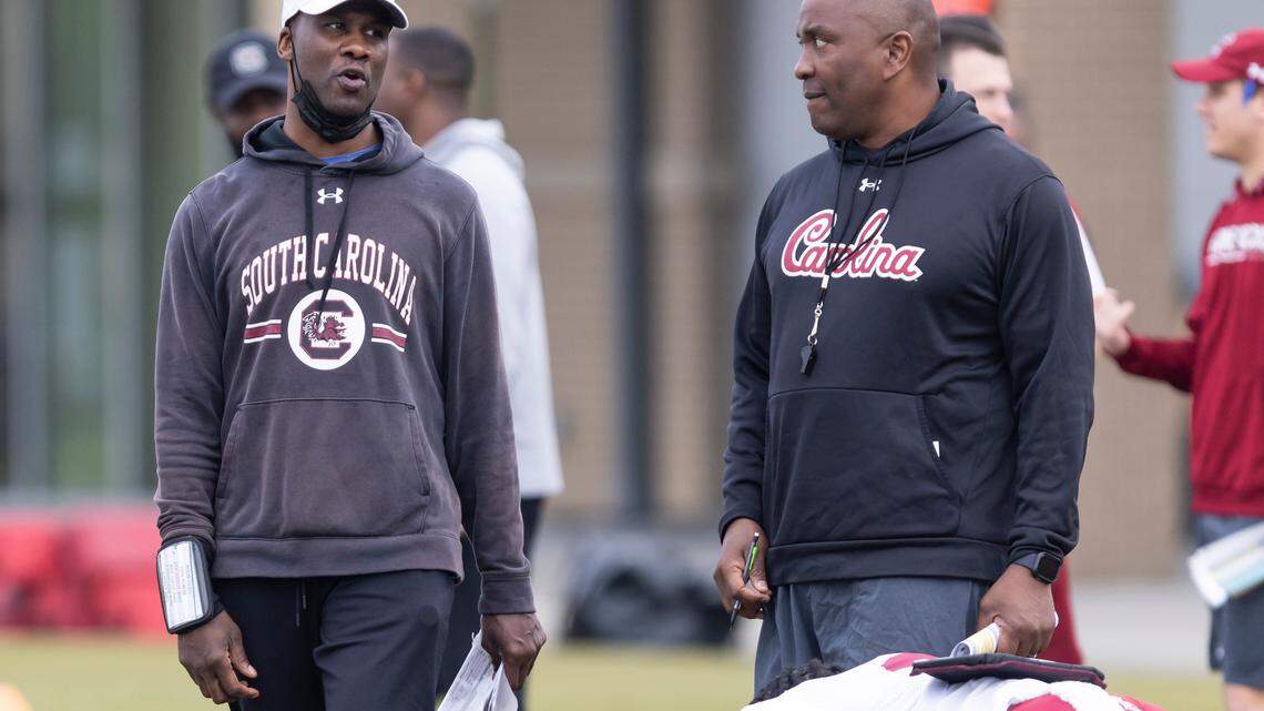 South Carolina defensive backs coach Torrian Gray, left, speaks with defensive coordinator Clayton White during the Gamecocks’ practice in Columbia on Thursday, March 23, 2023.