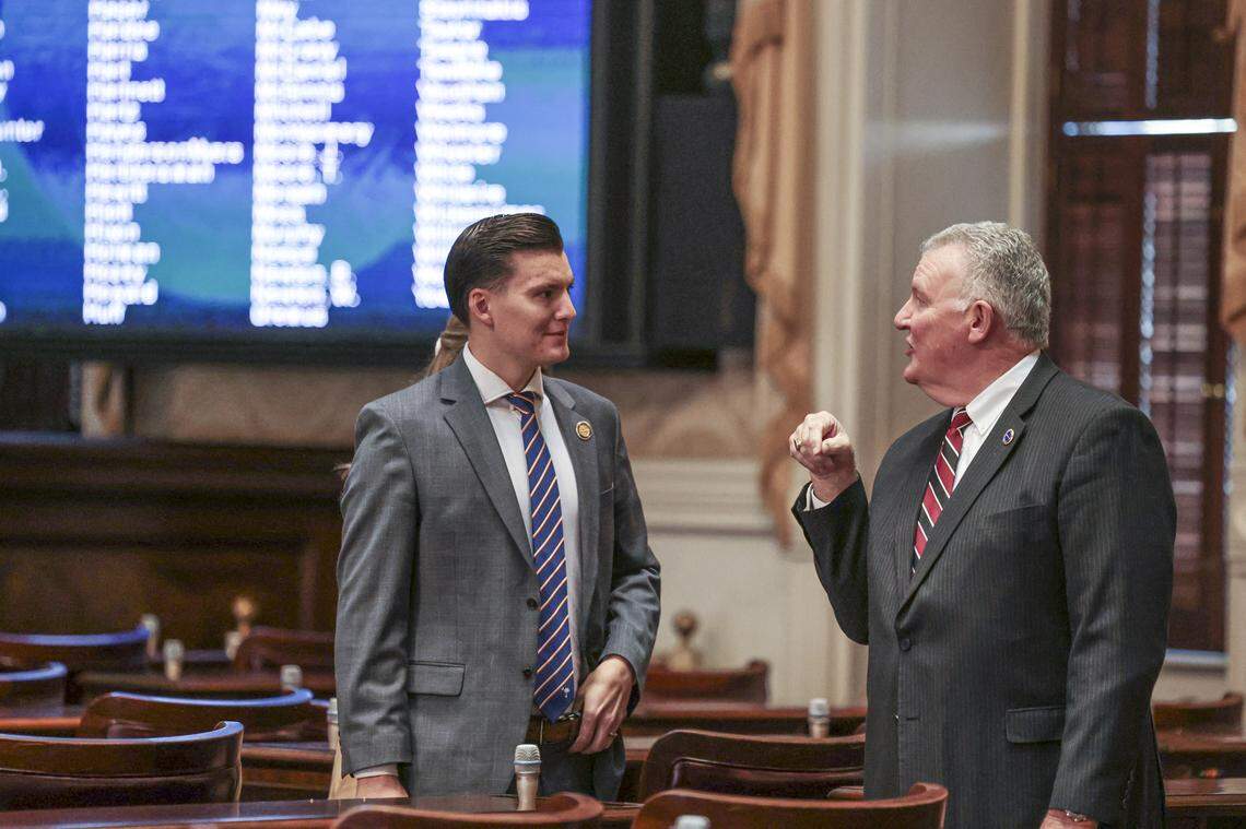 State Rep. Luke Rankin, left, talks with House staffer Richard Pearce on the floor of the South Carolina House of Representatives on Tuesday, Dec. 3, 2024.