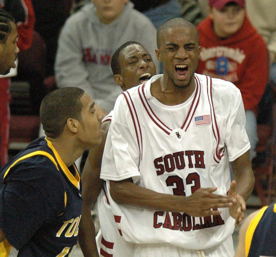 Soouth Carolina’s Brandon Wallace (front) and Tre Kelley celebrate a play against Toledo on Nov. 11, 2005.