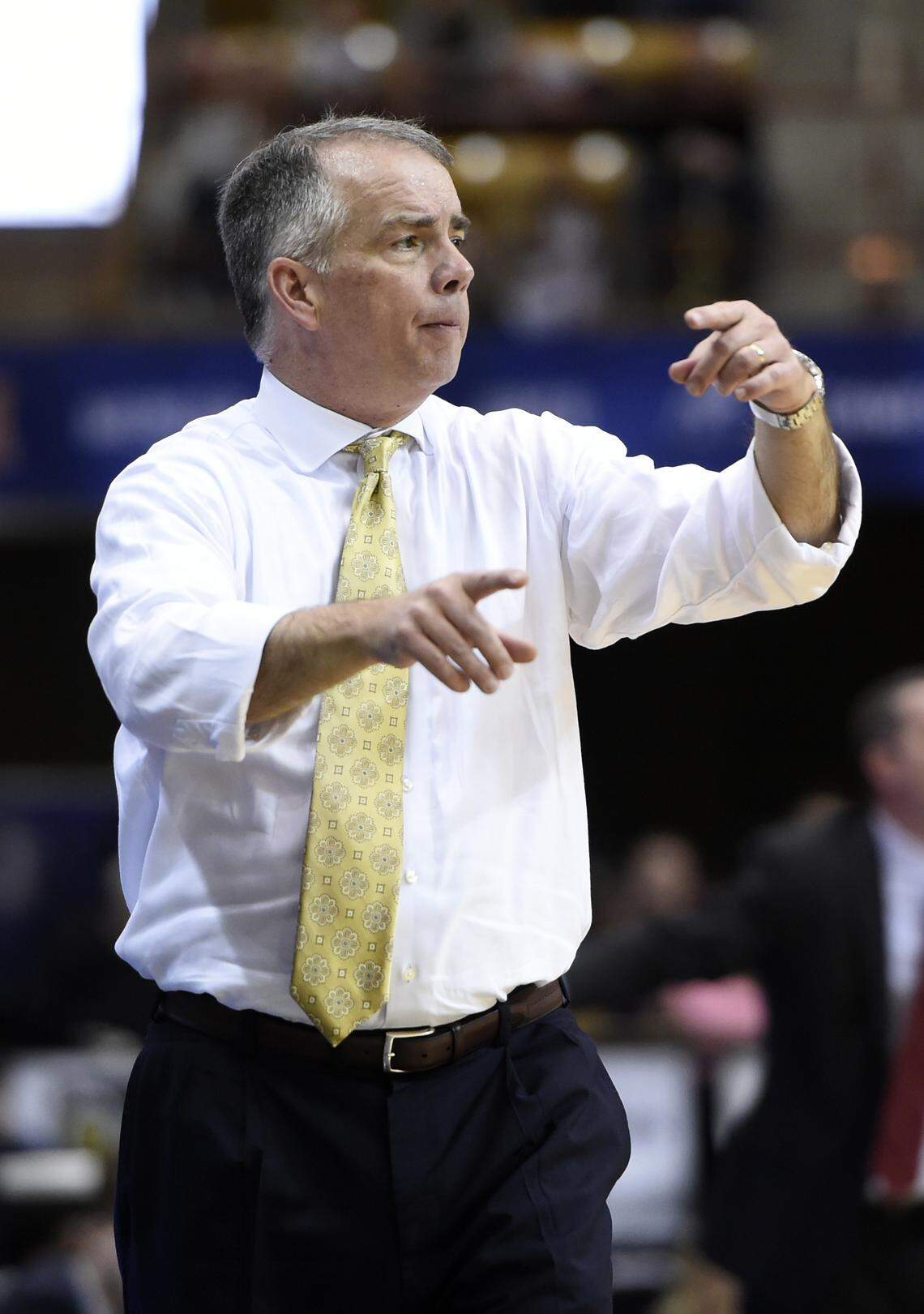 Wofford Terriers head coach Mike Young directs his team against VMI in the second half of an NCAA college basketball game for the Southern Conference basketball tournament championship, Saturday, March 9, 2018, in Asheville, N.C. Wofford won 99-72.