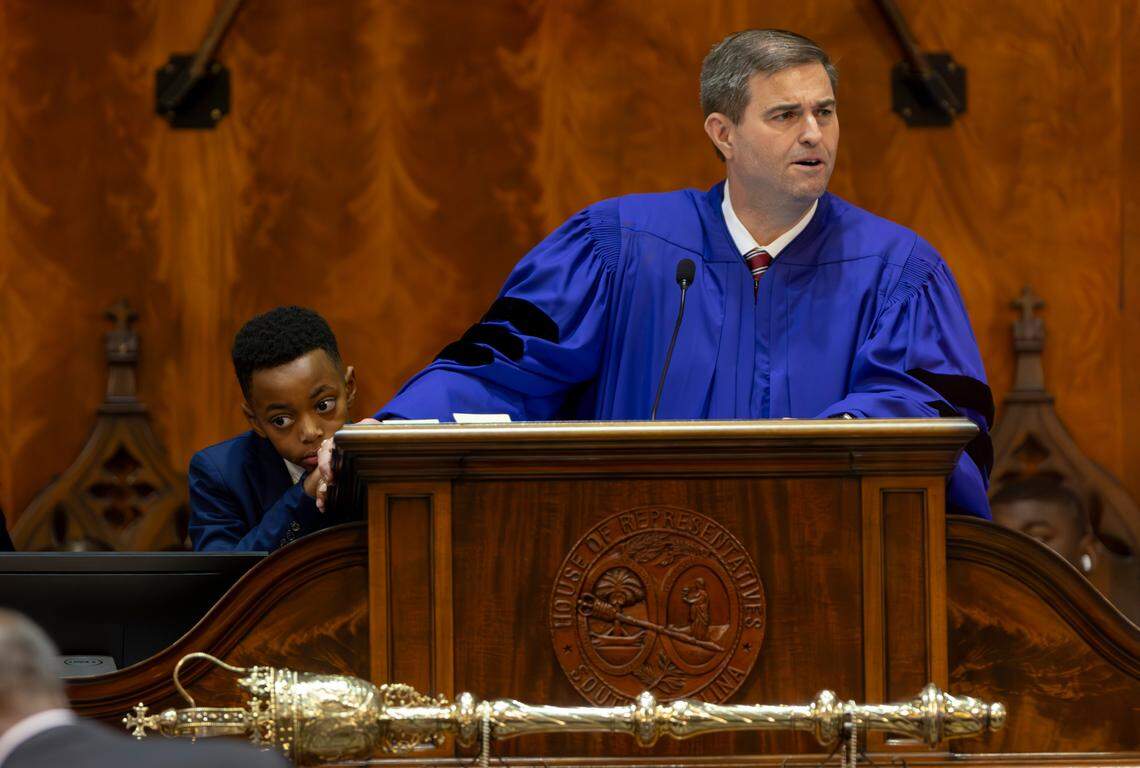 Kaleb Josiah Carter, 10, takes a break from helping S.C. House Speaker Murrell Smith, Jr. R-Sumter, manage the assigning of new seats in the South Carolina House of Representatives on Tuesday, Dec. 3, 2024.