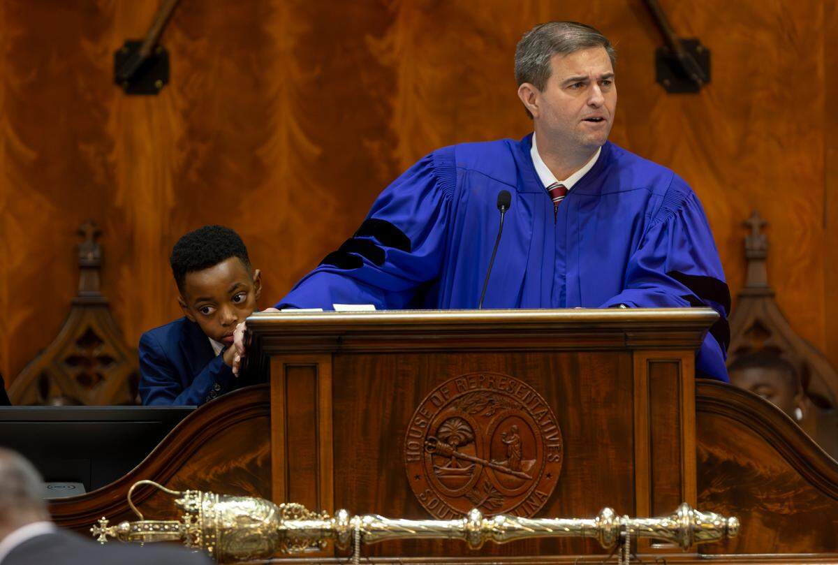 Kaleb Josiah Carter, 10, takes a break from helping S.C. House Speaker Murrell Smith, Jr. R-Sumter, manage the assigning of new seats in the South Carolina House of Representatives on Tuesday, Dec. 3, 2024.
