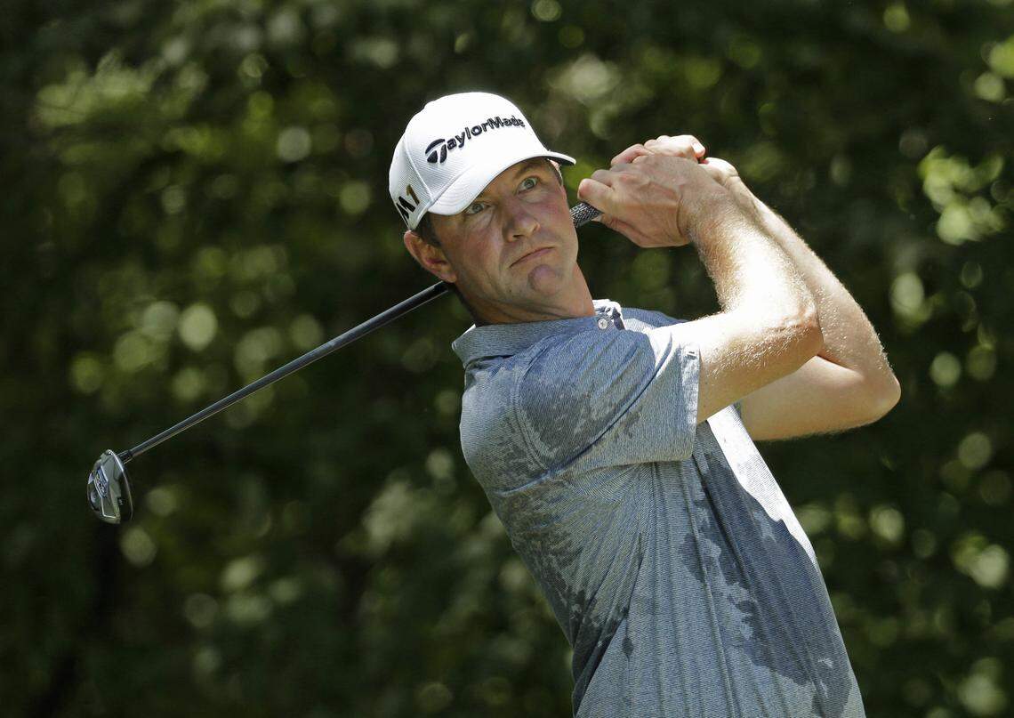 FILE - In this Aug. 20, 2016 file photo, Lucas Glover watches his tee shot on the second hole during the third round of the Wyndham Championship golf tournament in Greensboro, N.C. The wife of the former U.S. Open champion is facing domestic violence charges stemming from an altercation with Glover and his mother after he missed the 54-hole cut at The Players Championship. Krista Glover was arrested Saturday night, May 12, 2018, and taken to the St. Johns County Jail. She was released on $2,500 bond on Sunday.