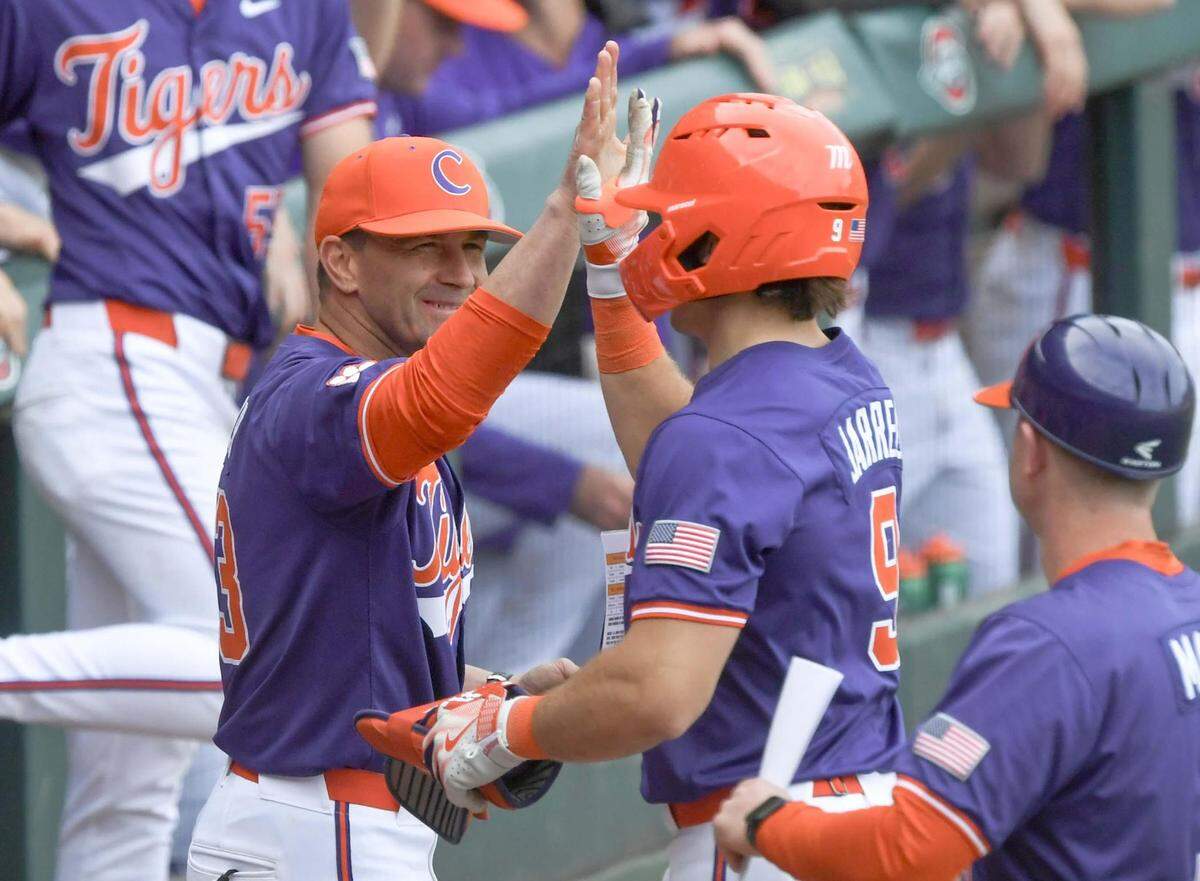 Clemson baseball coach Erik Bakich and catcher Jacob Jarrell (9)
