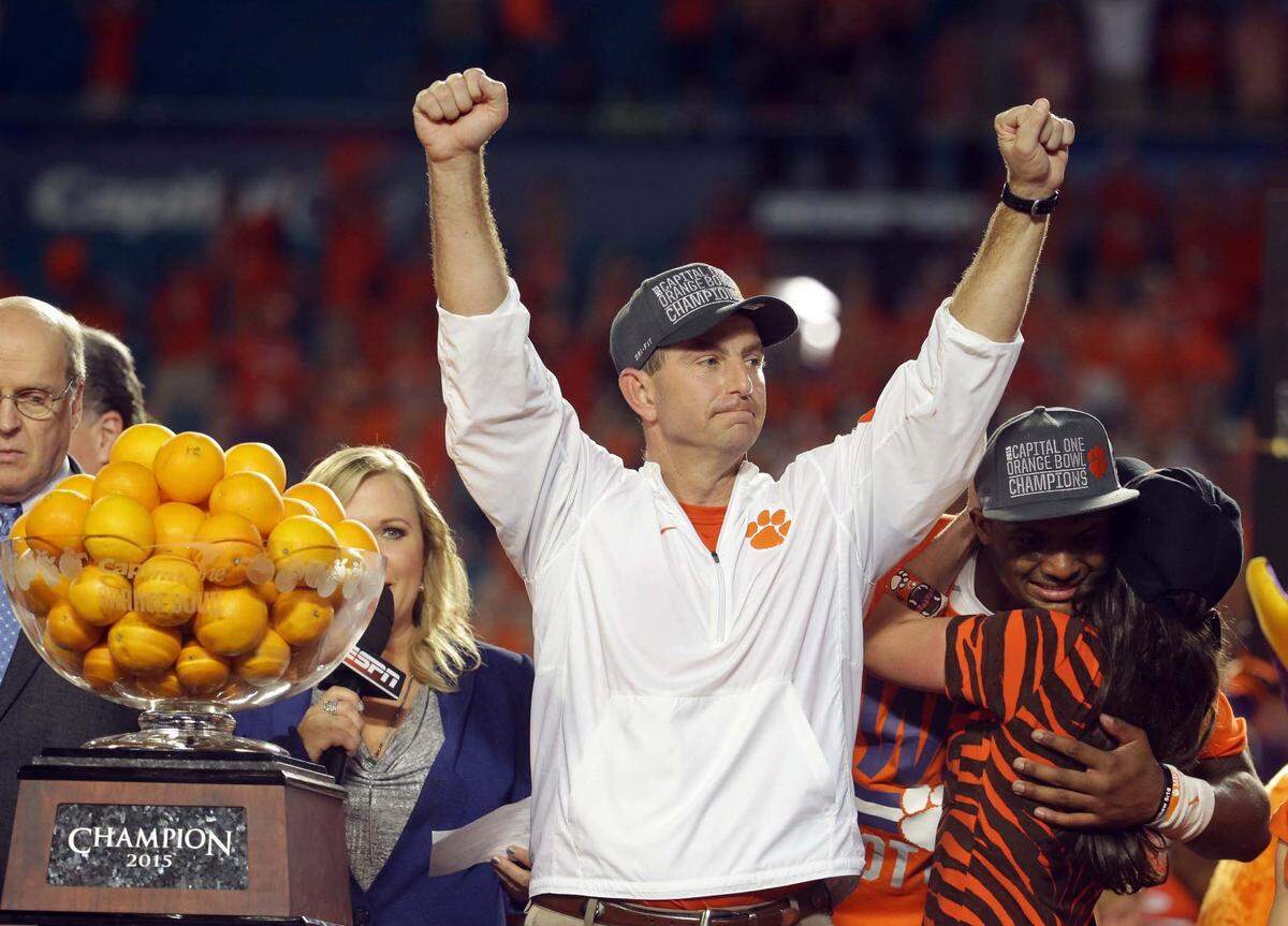 Clemson head coach Dabo Swinney raises his arms after winning the Orange Bowl NCAA college football semifinal playoff game against Oklahoma, Thursday, Dec. 31, 2015, in Miami Gardens, Fla. Clemson defeated Oklahoma 37-17 to advance to the championship game. (AP Photo/Lynne Sladky)
